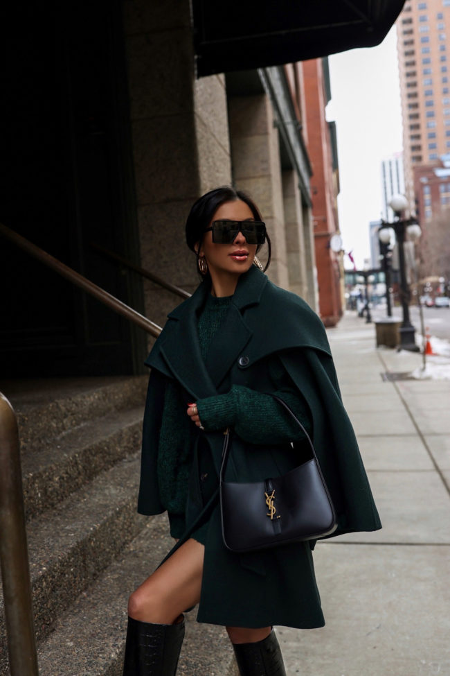 mia mia mine wearing a green cape from karen millen