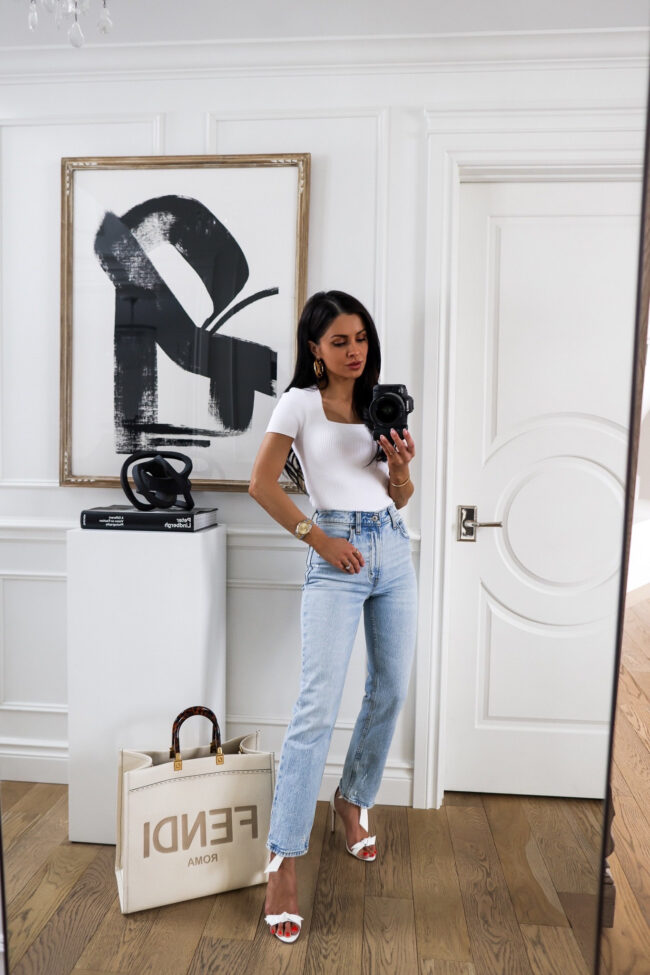 mia mia mine wearing straight leg jeans and heels