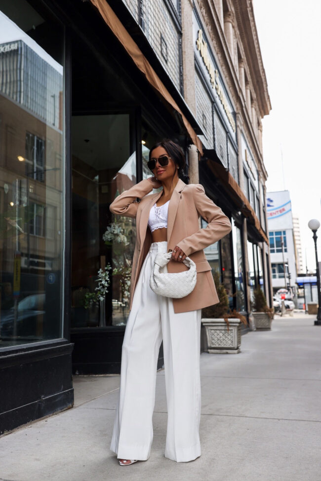 mia mia mine wearing white wide leg pants