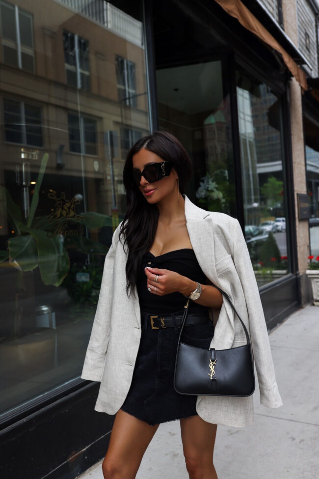 fashion blogger wearing a mango linen blazer and agolde denim skirt