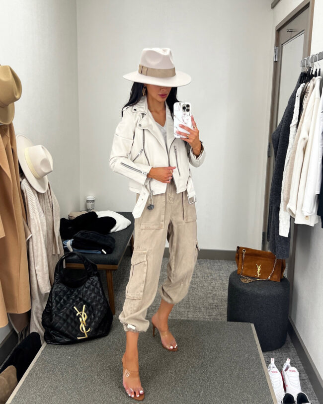 fashion blogger mia mia mine wearing cargo joggers and a white leather jacket by allsaints