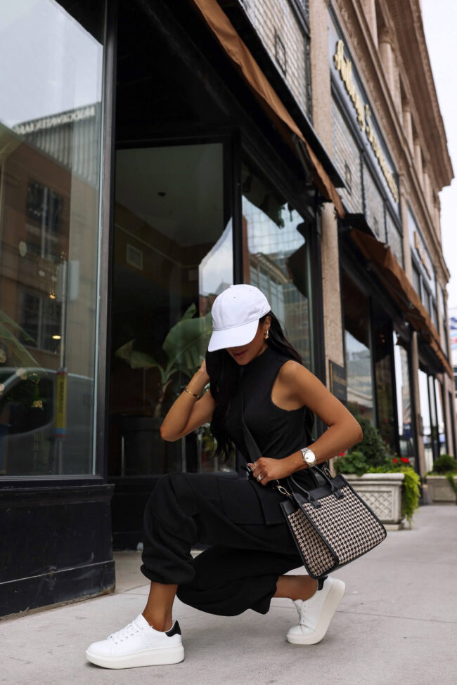 fashion blogger mia mia mine wearing cargo sweatpants and white sneakers from walmart