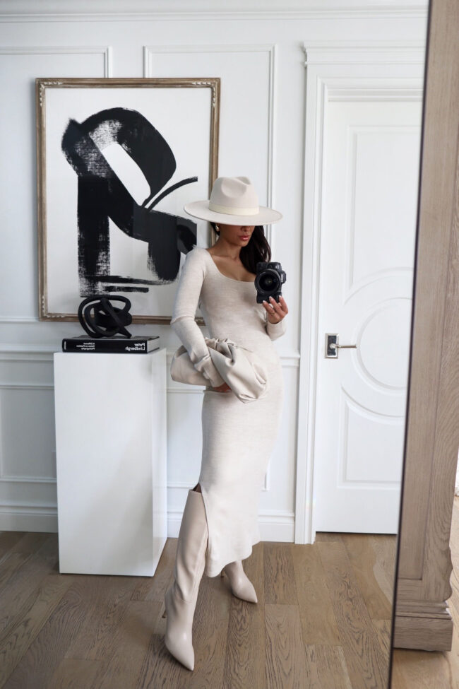 brunette fashion blogger wearing a sweater dress and knee high boots