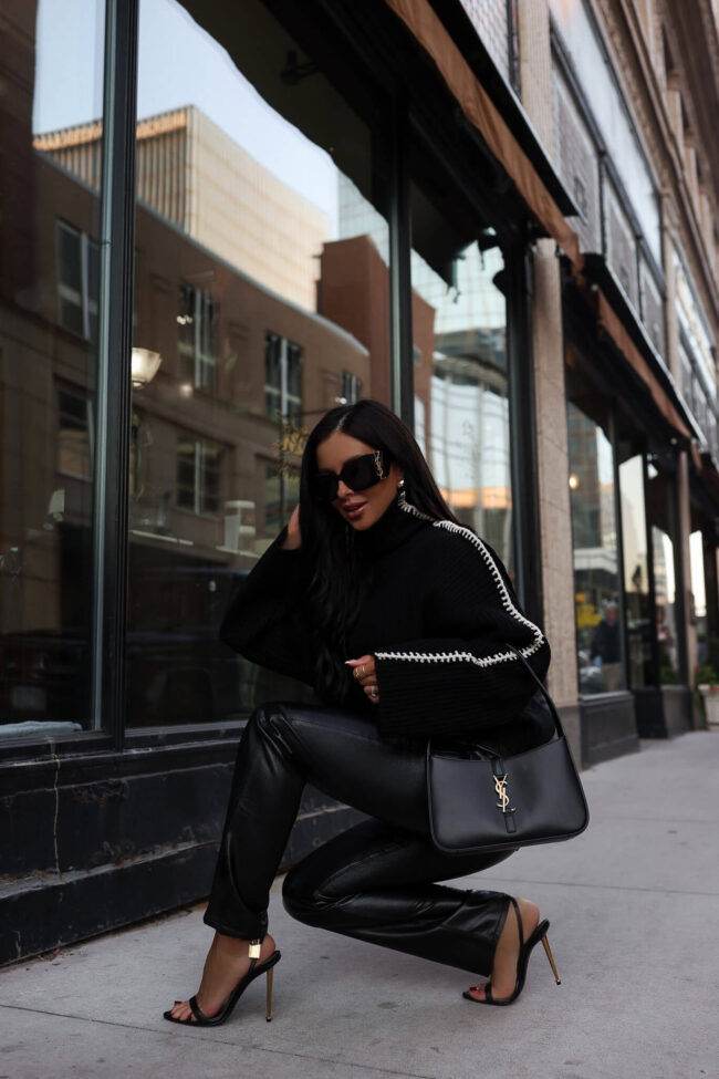 fashion blogger wearing agolde leather pants on sale at saks