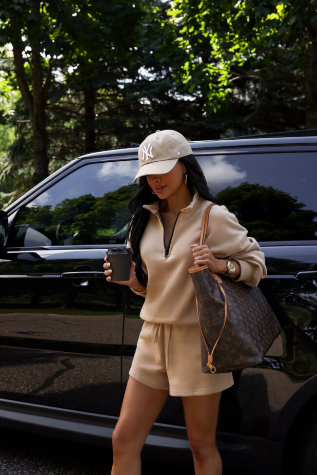 mia mia mine wearing a camel pullover and shorts from amazon