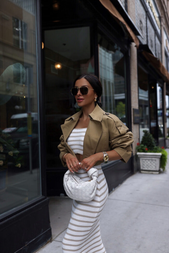 mia mia mine wearing an amazon stripe dress and cropped trench coat