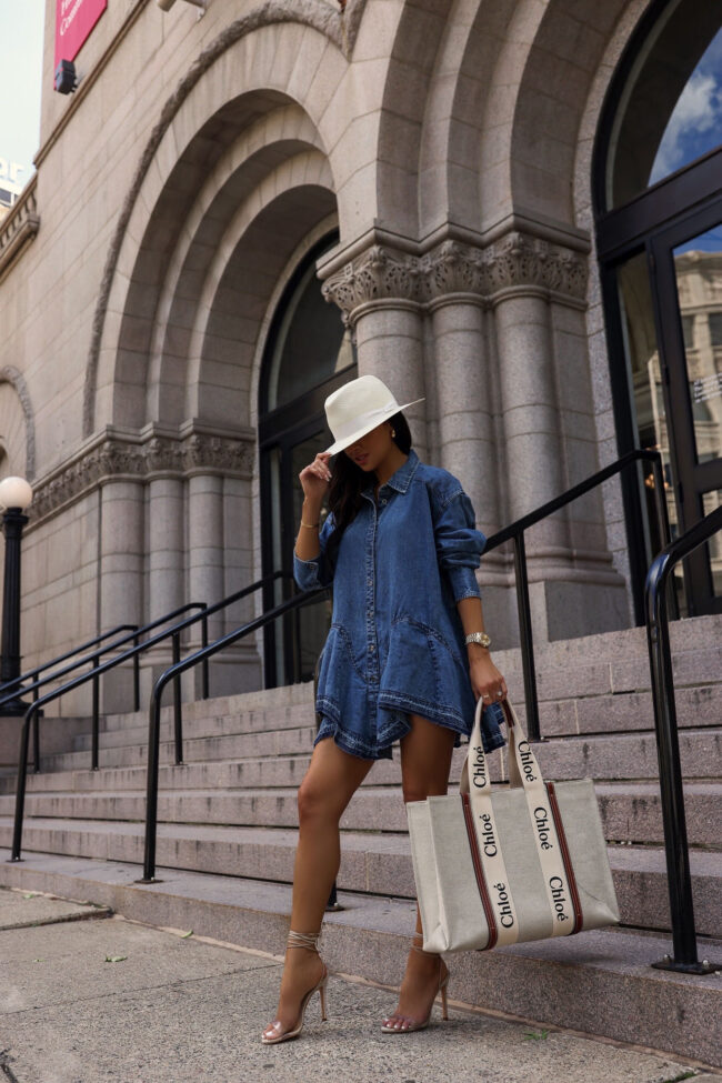 fashion blogger wearing a denim shirt dress for labor day weekend