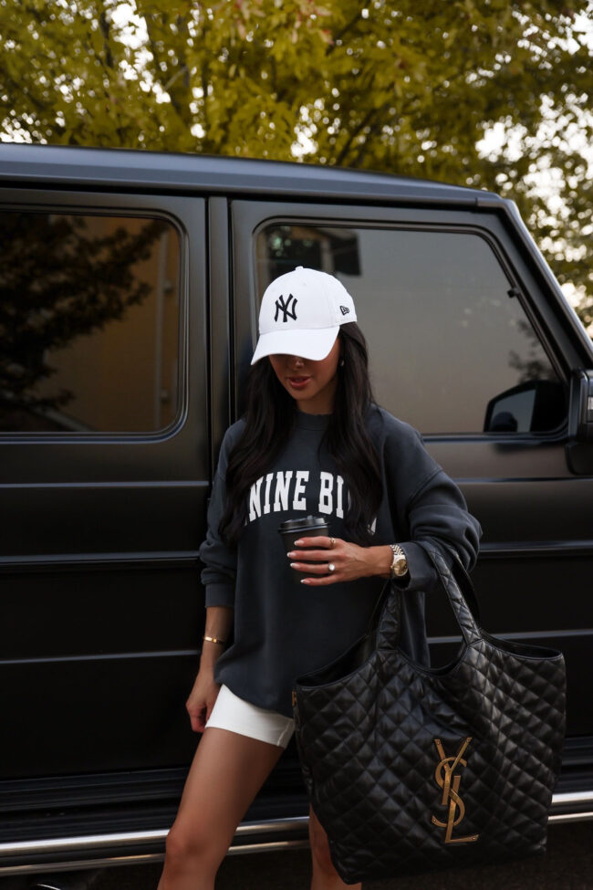 fashion blogger mia mia mine wearing an anine bing logo sweatshirt