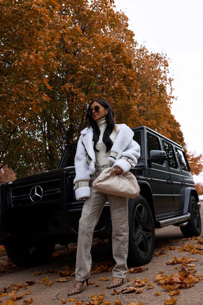 fashion blogger mia mia mine wearing agolde cooper jeans in beige