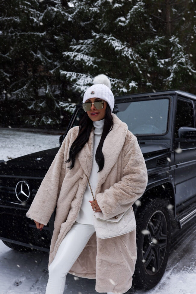 brunette fashion blogger wearing a faux fur coat from abercrombie