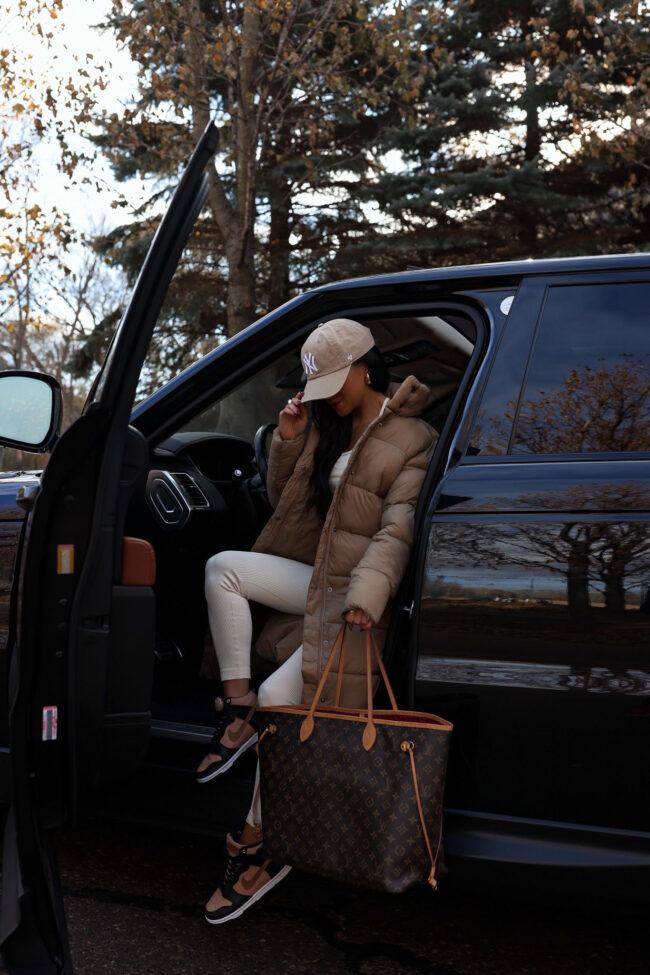 mia mia mine wearing an amazon basics long puffer coat
