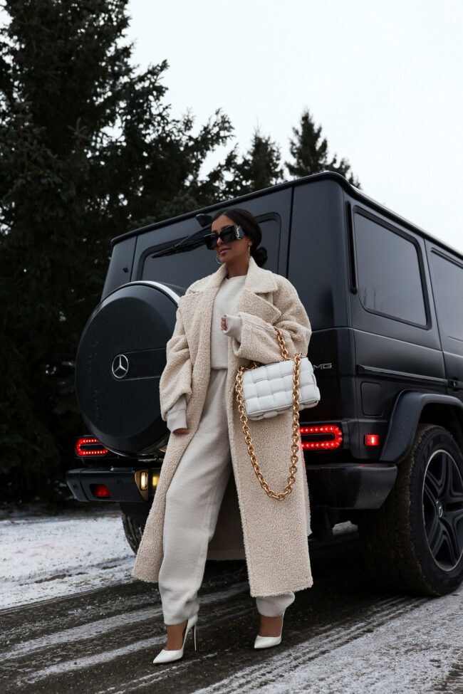 fashion blogger mia mia mine wearing a fleece teddy bear coat by good american from nordstrom