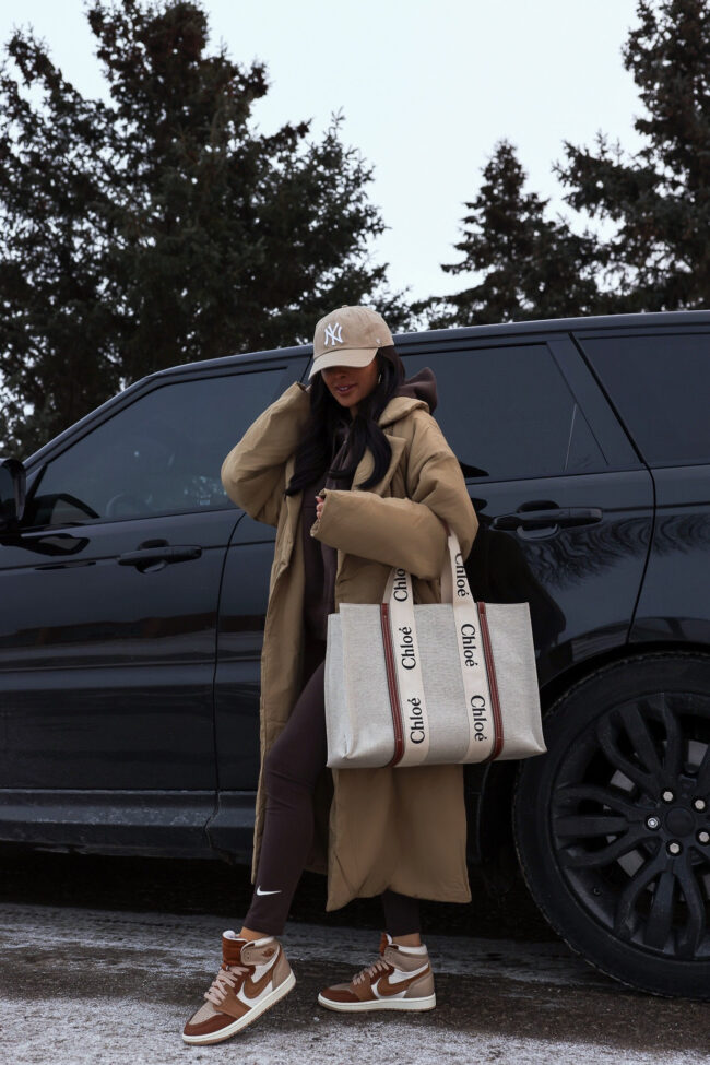fashion blogger mia mia mine wearing a good american puffer robe coat