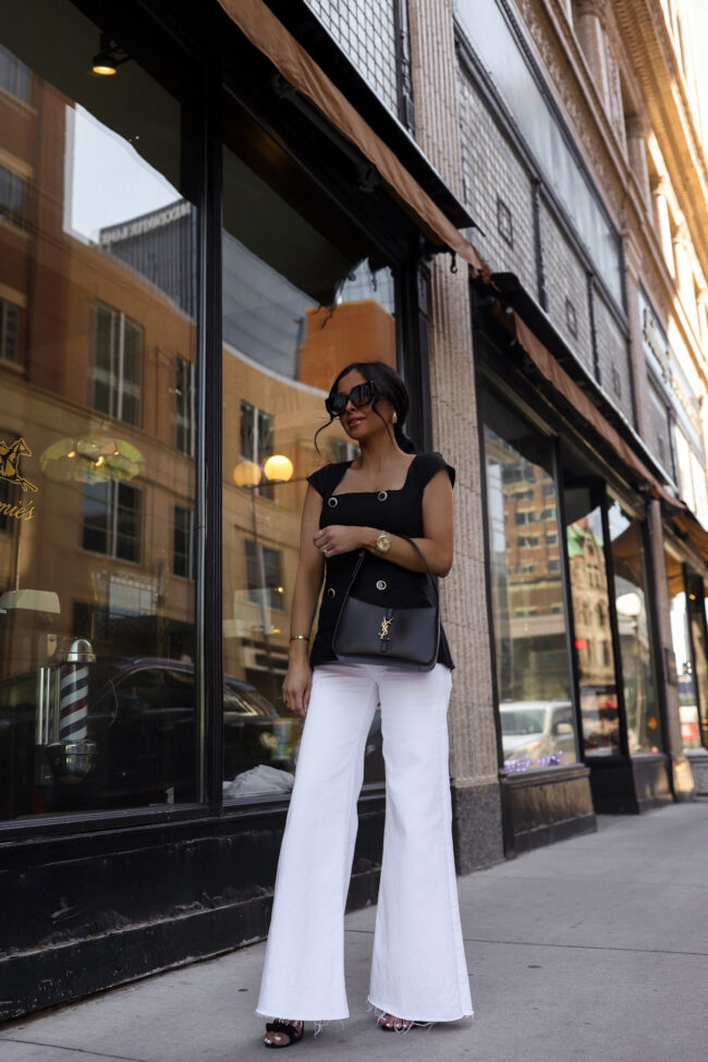 mia mia mine wearing white wide leg jeans from saks