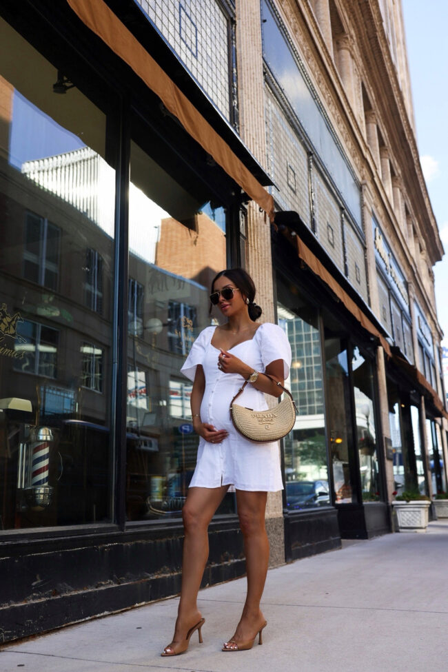 brunette fashion blogger wearing a white dress from abercrombie