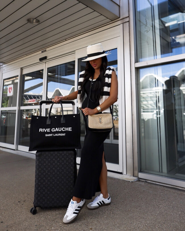 mia mia mine wearing a maxi skirt and adidas samba sneakers at the airport