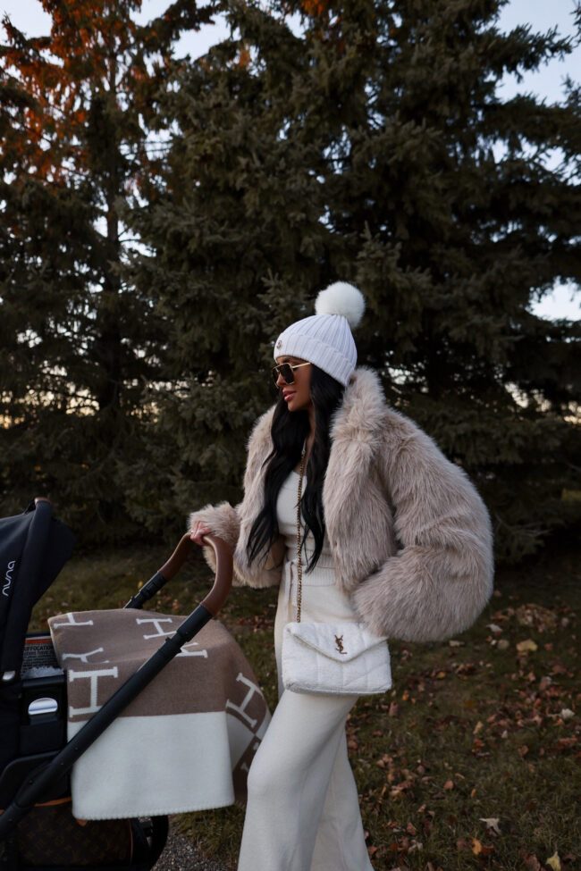 brunette fashion blogger wearing a cropped fur jacket