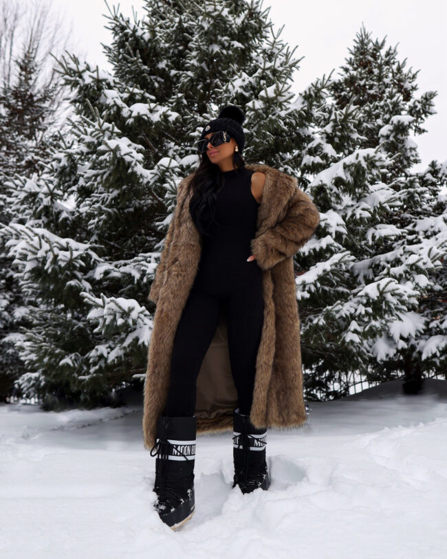 fashion blogger wearing a long faux fur coat from abercrombie