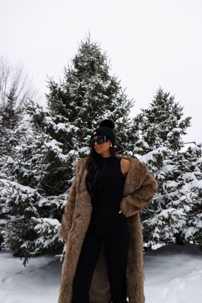 mia mia mine wearing a chic snow outfit