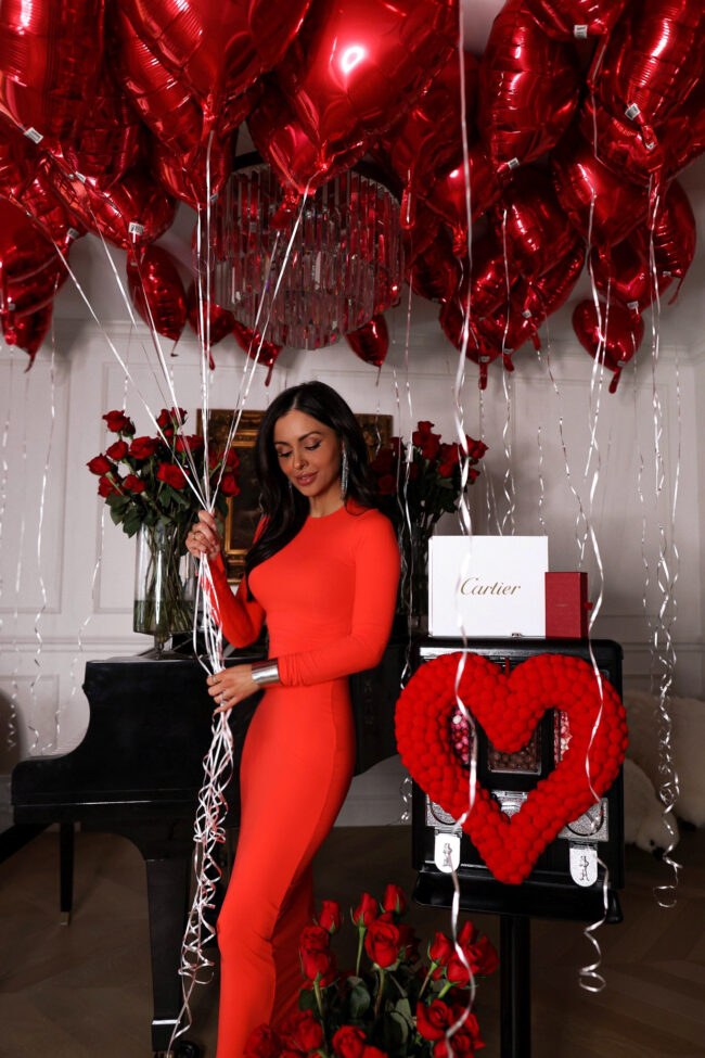 fashion blogger wearing a red maxi dress from skims