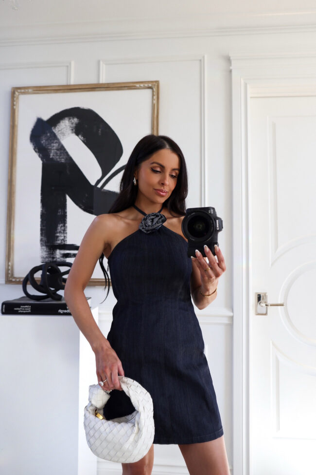 fashion blogger wearing a denim halter neck dress
