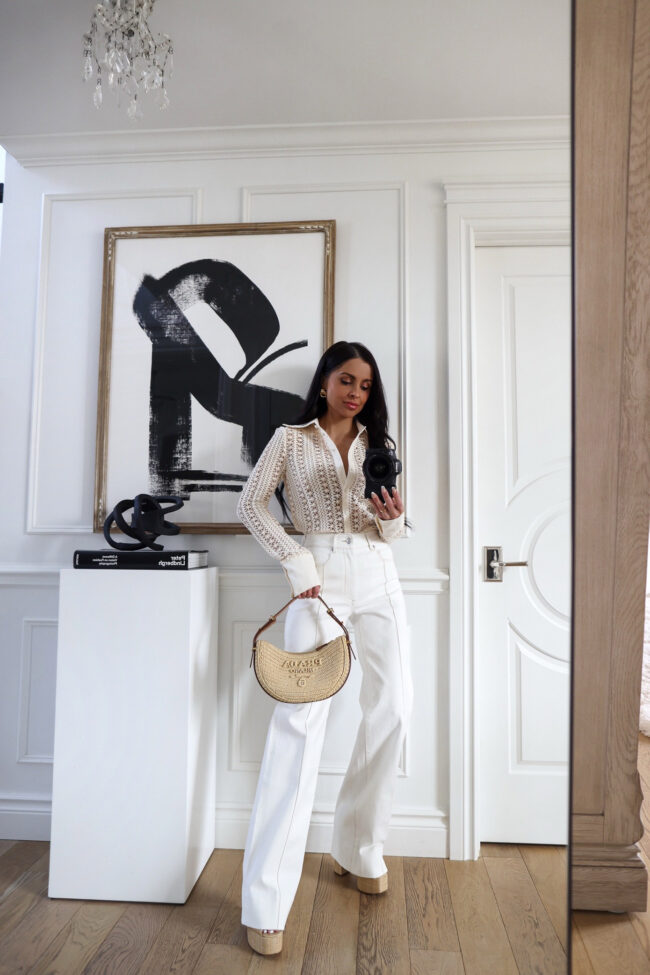 fashion blogger wearing an open knit button up shirt from shopbop