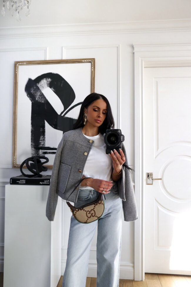 brunette fashion blogger wearing a gray knit jacket