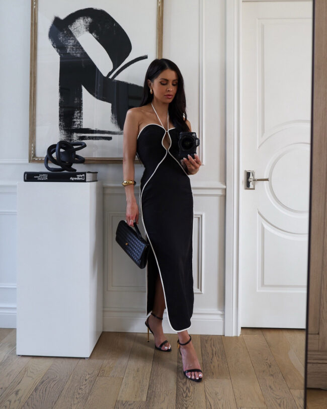 mia mia mine wearing a farm rio black dress