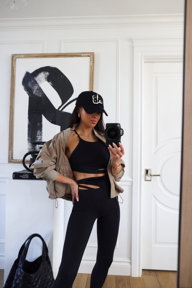 fashion blogger wearing a beige bomber jacket from lululemon