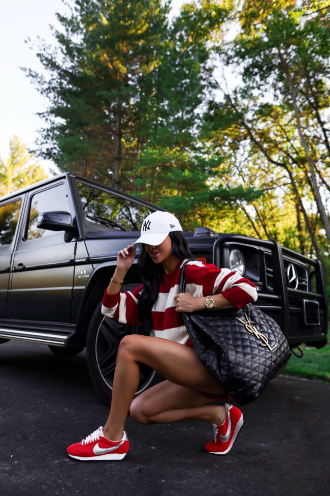mia mia mine wearing red nike sneakers