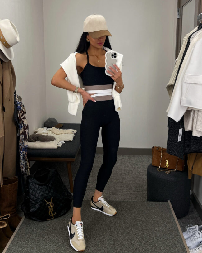 brunette fashion blogger wearing a beyond yoga set from the nsale