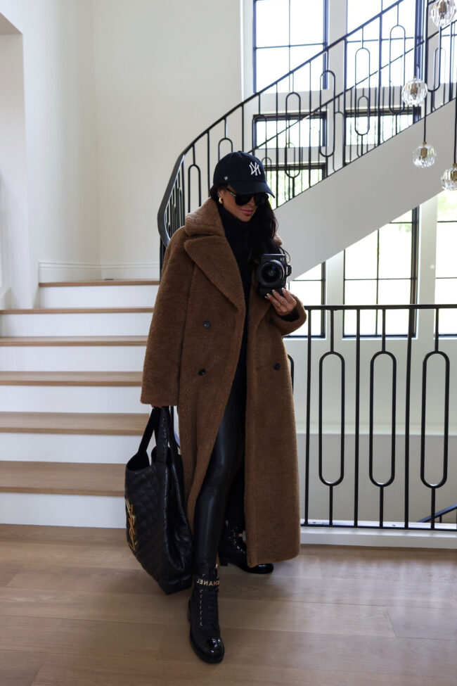 brunette fashion blogger wearing a long faux fur coat from the nordstrom anniversary sale