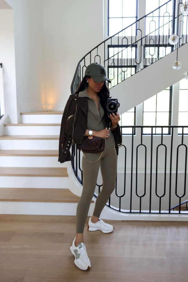brunette fashion blogger wearing green varley leggings from the nordstrom sale
