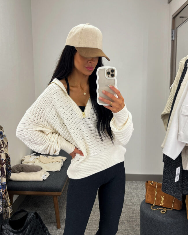 brunette fashion blogger wearing a varley crochet pullover from the nsale