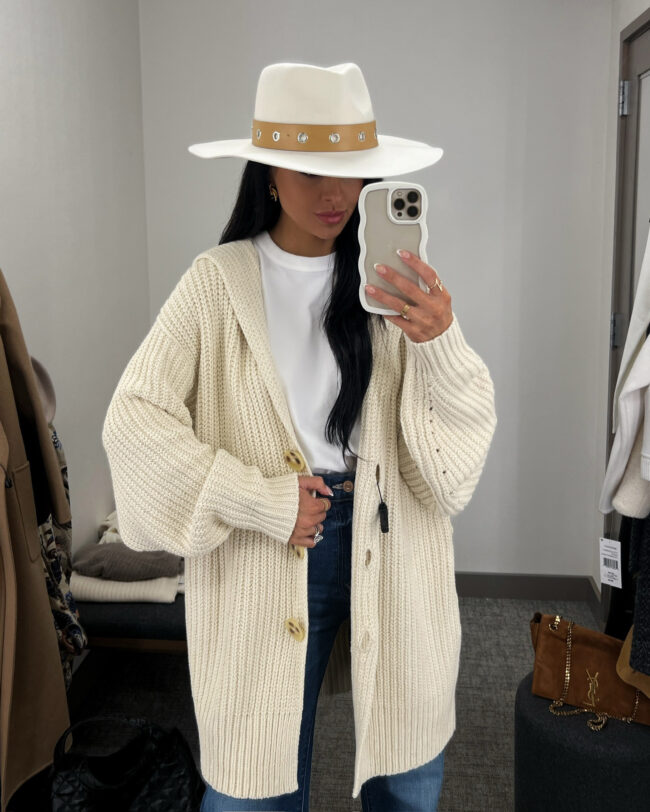 fashion blogger wearing an oversized free people cardigan from the nsale