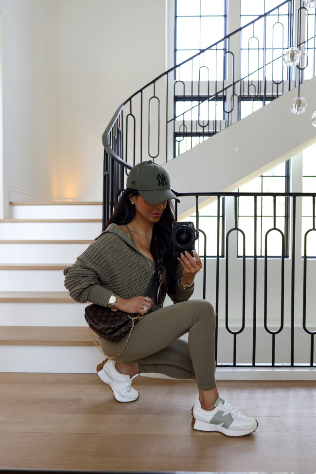 fashion blogger wearing green new balance 327 sneakers from the nordstrom anniversary sale