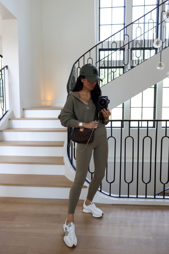 fashion blogger wearing a green activewear set from varley at the nordstrom sale