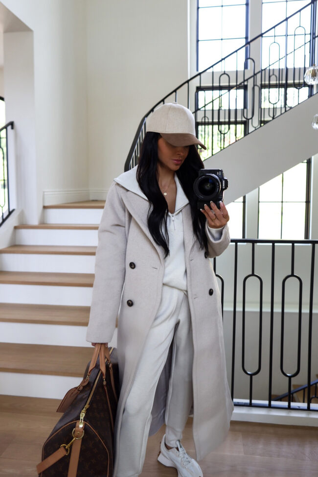 mia mia mine wearing an ivory coat from the nordstrom anniversary sale